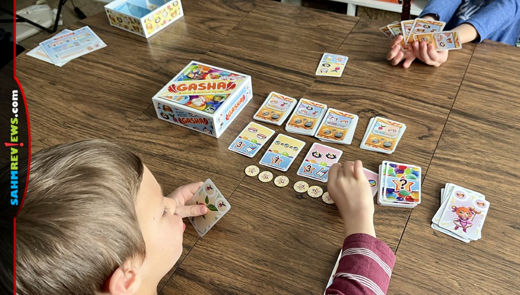 Those toy-dispensing, coin-gobbling machines come to the game table in Gasha, a card game from 25th Century Games.